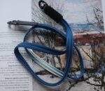 Close up of HOZUMA Blue Mt. Fuji Kumihimo silk camera strap showing braided texture, attached to a black Leica M11 camera.