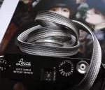 We have adopted the braiding technique known as Bamboo-gumi, which dates back to the Kamakura period and was primarily used for horse bridles (omogai). Its characteristic is that a variety of patterns can be created through different combinations of the braided cords. It's a flat, soft camera strap. The ring conection part is sewing with the leather，it is best to match the color you prefer with the leather you are making the Kumihimo with.