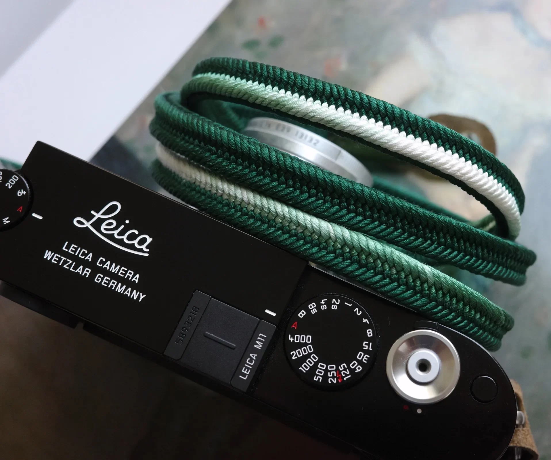 Crown Dark Green is a handmade camera neck strap made with Japanese kumihimo silk and genuine leather. Comfortable, durable, and ideal for premium cameras.