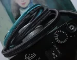 Crown Lividity Blue is a handmade camera neck strap made with Japanese kumihimo silk and genuine leather. Comfortable, durable, and ideal for premium cameras.