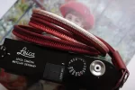 Crown Red is a handmade camera neck strap made with Japanese kumihimo silk and genuine leather. Comfortable, durable, and ideal for premium cameras.