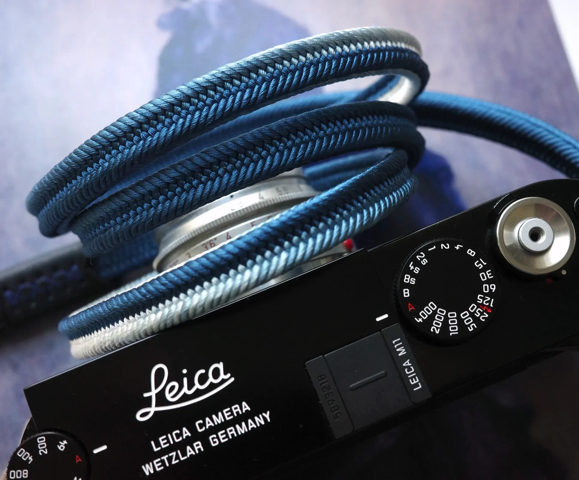 Crown Royal Blue is a handmade camera neck strap made with Japanese kumihimo silk and genuine leather. Comfortable, durable, and ideal for premium cameras.